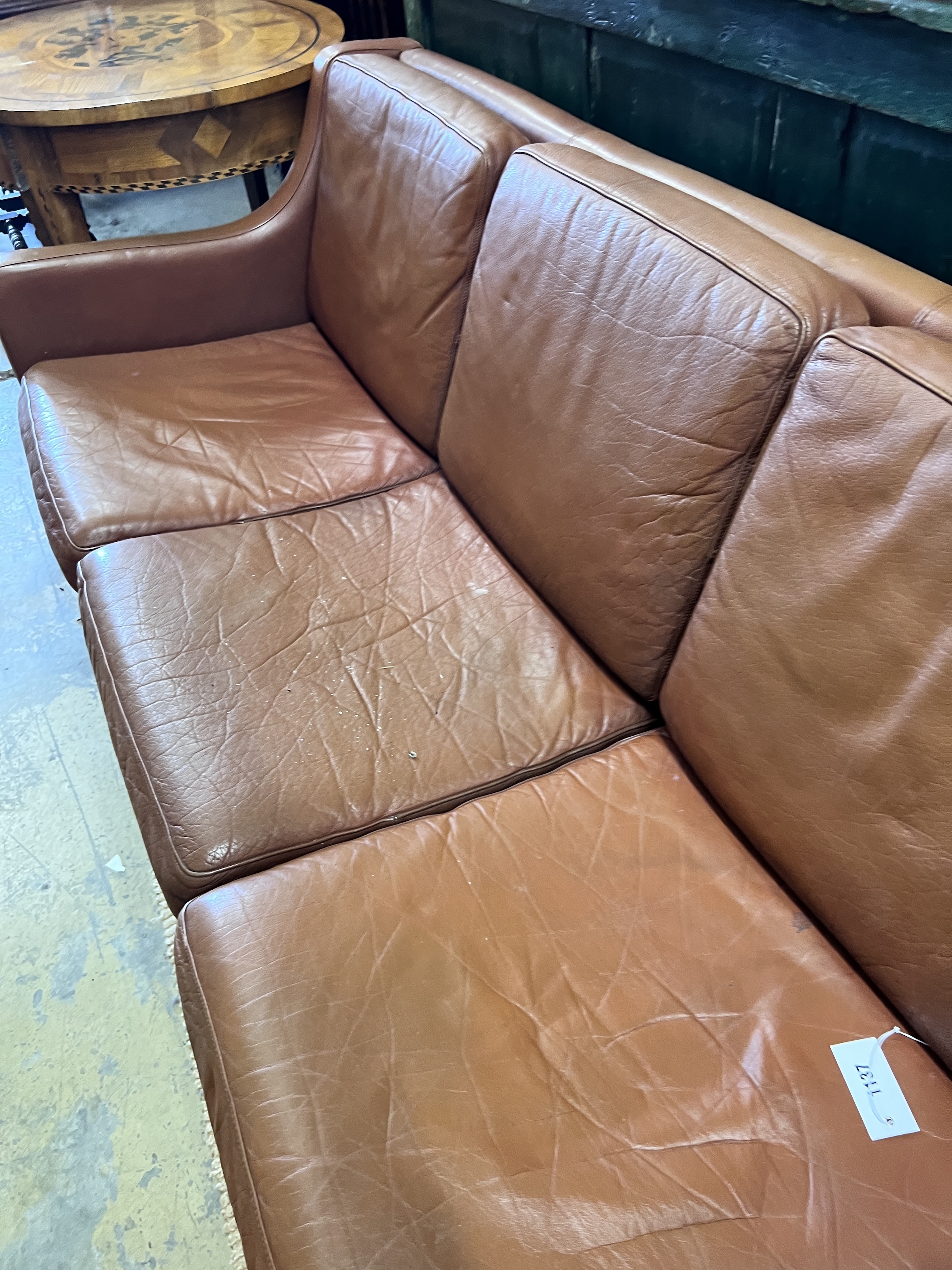 A mid century Danish tan leather sofa in the style of Borge Mogensen, length 182cm